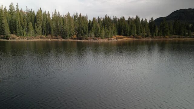 Aerial reveal up from Molas Lake in San Juan Mountains in southern Colorado near Silverton
