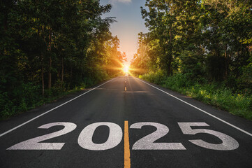 New year 2025, Text 2025 written on the road in the middle of asphalt road at sunset. Concept of...