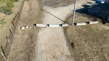 Aerial View of Rural Road Blocked by Concrete Barriers