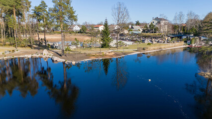 Fototapeta premium Aerial View of Construction Site Near Pond
