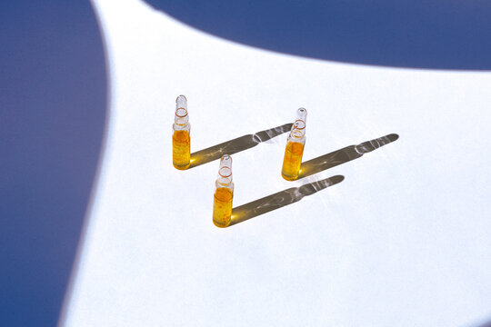 Rejuvenating glass anti-age beauty ampoules, precious oils and vitamins for the dry aged skin