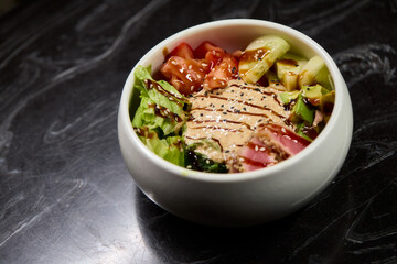 A Fresh and Colorful Salad Bowl that features Grilled Chicken and a Variety of Vegetables