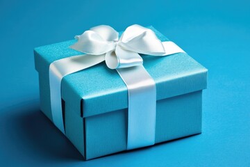 Obraz premium Festive Gift Box with Golden Ribbon on Vibrant Blue Background