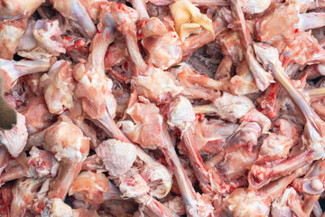 Raw chicken bones, production leftovers. Background texture