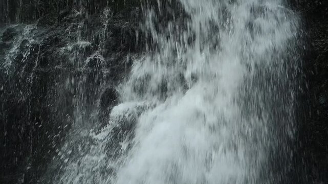 Closeup of a waterfall flowing over mossy stones, slow motion, Josefsthaler Wasserf&auml;lle