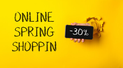 Person holding a cell phone with the words Online Spring Shop written on it
