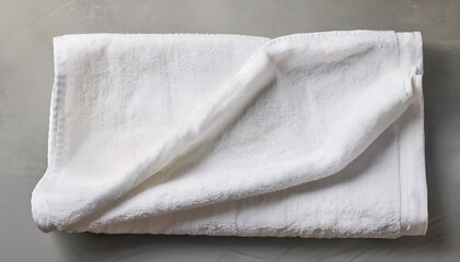 Crumpled white cotton towel mockup showcasing fabric softness on a flat surface. Generative AI