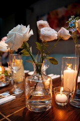 Elegant Table Setting with Roses and Candles
