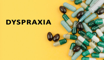 A bunch of pills with a syringe on top of them