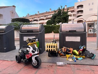 Сhildren's toys thrown in the trash