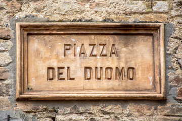 Piazza del duomo street sign in San Gimignano