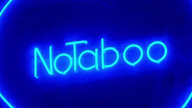 No Taboo inscription in blue color at sex shop window. Peccability and moral degradation of society, decline in morals