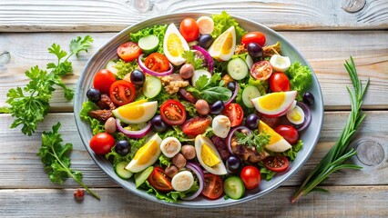 vivid and bold artistic presentation of Nicoise salad on light wooden surface aerial