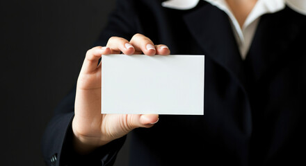 Closeup of businesswoman holding blank white business card.