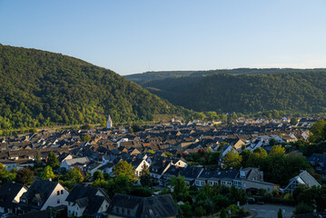 Cityscape sunset view of the town of Winningen, Germany with picturesque grape vineyards