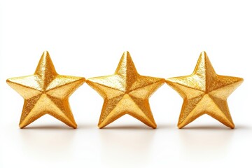 Obraz premium Three golden stars on a white isolated background.