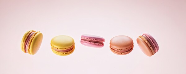 Obraz premium Delicate French macarons arranged in colorful rows on a soft pastel background showcasing their texture and flavors