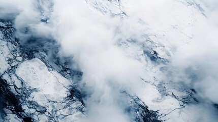 Aerial View of Icy Glacier with Cloud Cover