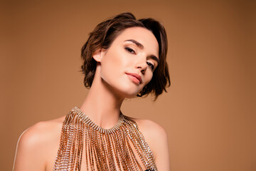 Photo of attractive celebrity lady wealthy clubbing wear glitter golden necklace isolated beige...