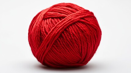 A bright red ball of woolen yarn is shown against a plain white background. The yarn is twisted and the picture is clear. The red color is vibrant.