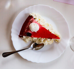 Delicious cake with strawberry glaze and whipped cream