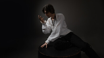 The dramatic hero calls out to the gods in the pose of a praying man, the style of classical...