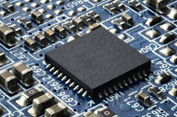 Small semiconductor on a circuit board, extreme closeup