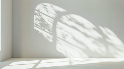 An abstract, gentle light beige background offers a minimalist space for product presentation, enhanced by soft shadows from window light and delicate wall vegetation. product showcase