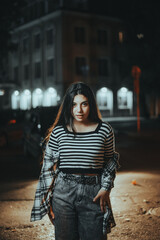 Confident Brunette Standing in the Night City