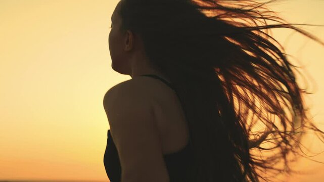 inspirational sunset run, girl jogging towards the horizon's end, evening jog with a picturesque sunset, female runner silhouetted by the setting sun, unforgettable run as the sun sets, girl sprinting