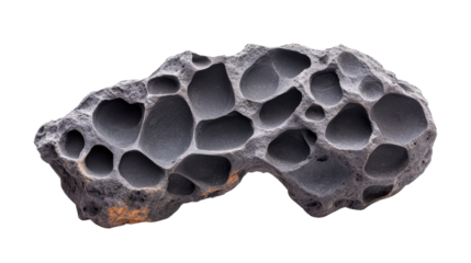 Close-up of a porous black volcanic rock with unique holes, showcasing natural texture and geological features against a white background.