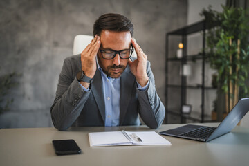 businessman have migraine while work on new project in modern office