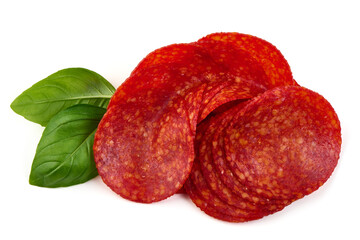 Spanish pork chorizo sausage slices, close-up, isolated on white background.