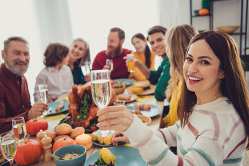 Photo of charming cheerful happy people relatives celebrating thanksgiving day indoors room home