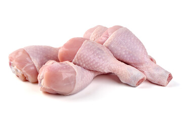 Raw chicken drumsticks, isolated on white background.