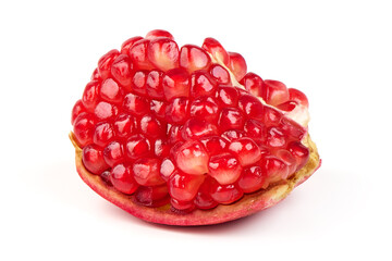 Fresh pomegranate with half sliced open showing seeds, isolated on white background.