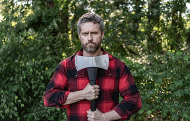 Lumberjack axe. Man with logging axe. Hardworking brutal man. Lumberjack hardworking outdoor....