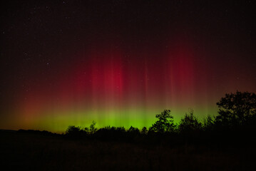 Aurora pillars shine in the night sky above the allegheny mountains