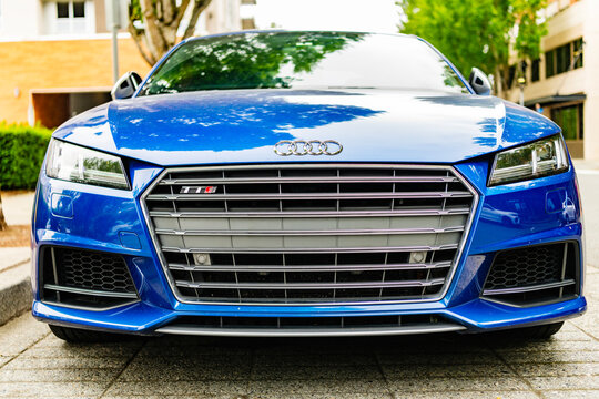 Seattle, USA - July 22, 2024: 2016 Audi TTS Coupe parked outdoor, front view. Audi TTS coupe in the street. Luxury car of Audi TTS. Audi dealership