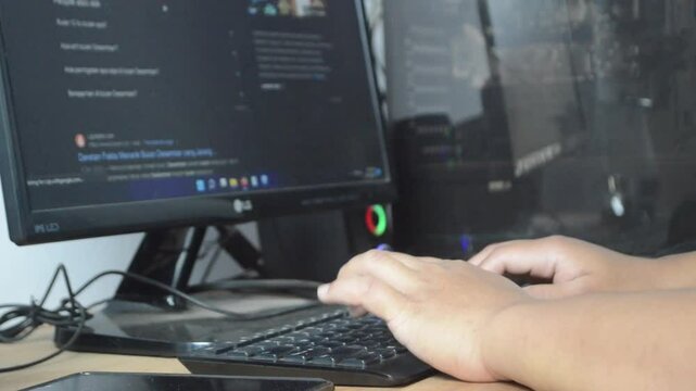 Activities in front of the PC, browsing, typing, surfing the internet. Working in front of a computer. The era of digitalization
