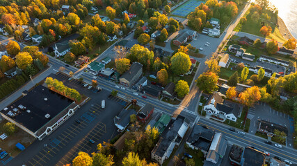 Aerial view of Schroon Lake, NY, highlighting the charming small town, vibrant autumn trees, and...