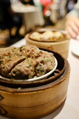 Bamboo steamers containing ngao yuk (beef meatballs) and pork and scallop siu mai at The Eight, a yumcha restaurant at Sydney Chinatown - Haymarket, NSW, Australia