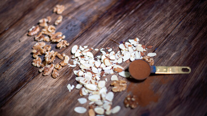 ingredients to make a cake, walnuts, almonds and cinnamon a powder