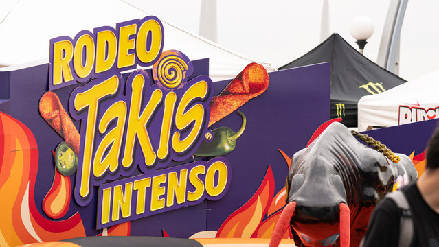 Budokan Geek Convention In GUAYAQUIL, ECUADOR - 
OCT 13, 2024 - A promotional stand for Takis Intenso snacks, featuring a bold &ldquo;Rodeo&rdquo; theme with a mechanical bull and spicy branding. 