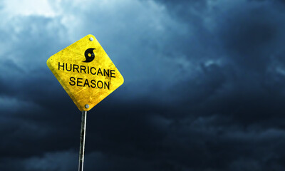 hurricane season sign yellow orange color storm weather nature climate wind environment danger sky...
