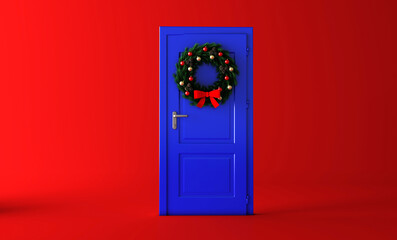Festive christmas wreath of fir branches on a blue door. Festive mood.