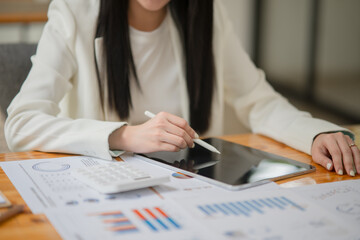 Asian business woman working and talking at the office
