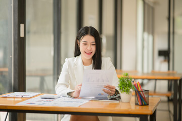 A businesswoman is working in an office.