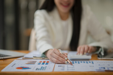 Asian business woman happily working at the office