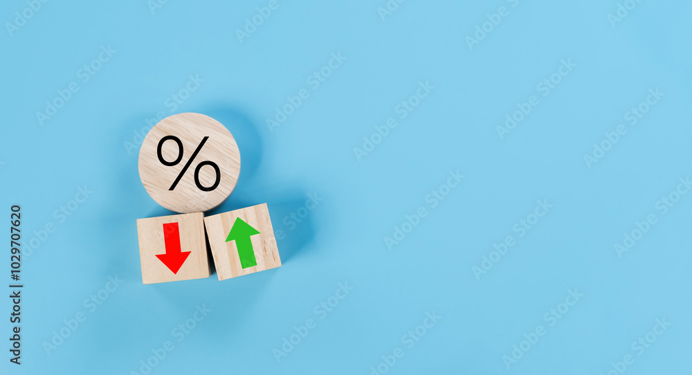 Poster Percentage icon on wooden cube block and up and down arrow symbol on flipping white dice on blue background